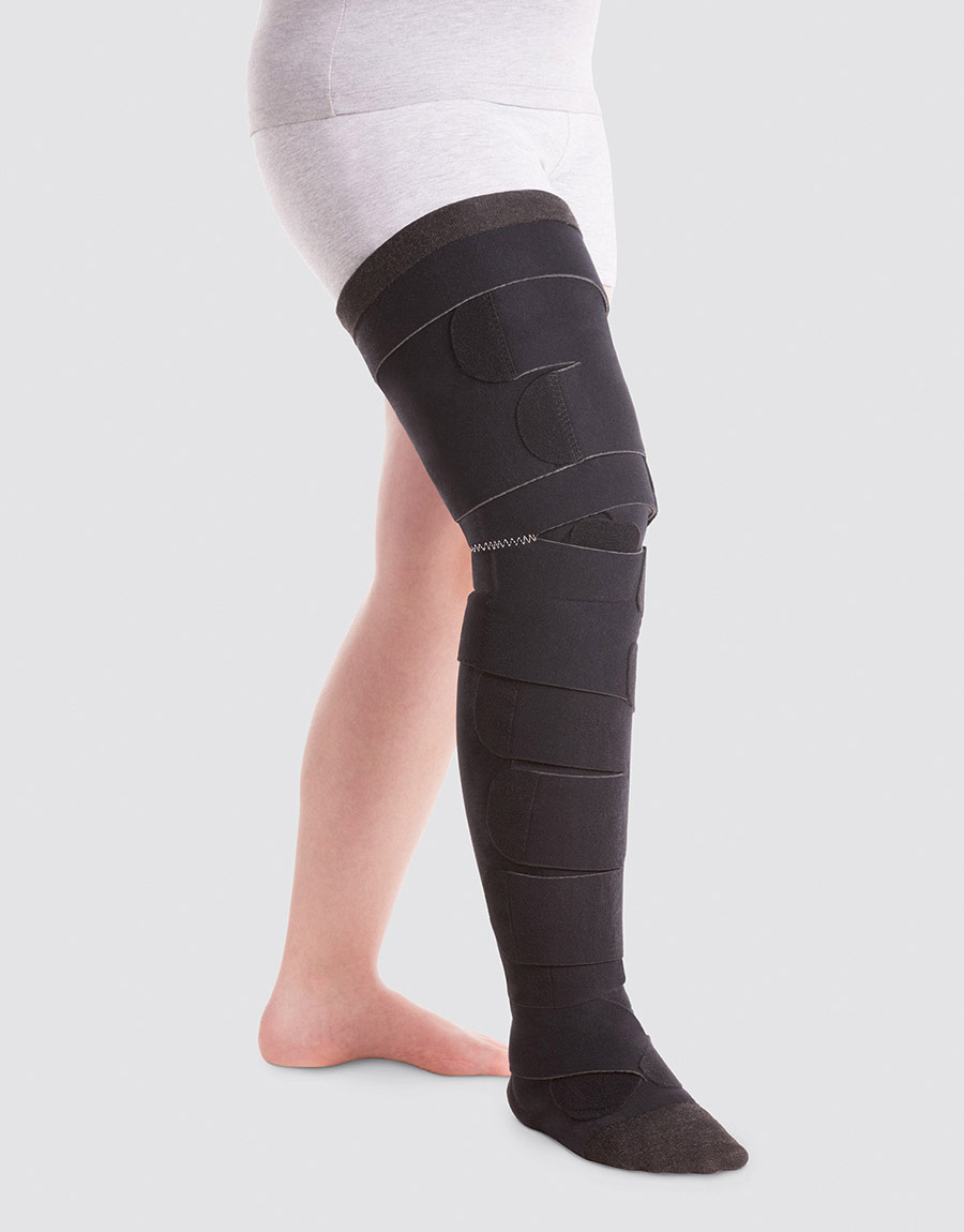 A person is wearing a combination of Juzo ACS Light leg segments A person is wearing a combination of Juzo ACS Light leg segments