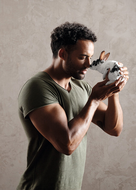 Strong man has a bunny on his hand